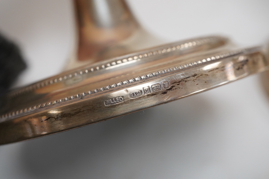 A pair of Elizabeth II silver candlesticks, with tapering stems, on circular foot, Broadway & Co, Birmingham, 1993, height 27cm, loaded.